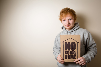 Ed Sheeran holds No Going Home sign