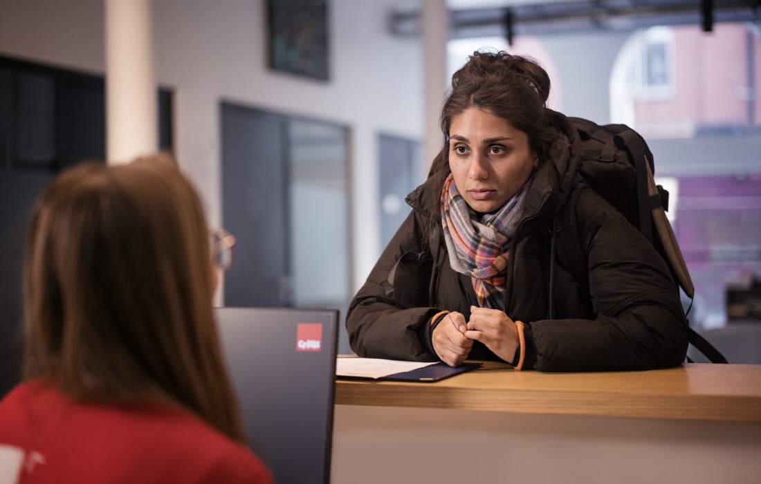 A Crisis member, Anita, arriving at Crisis reception