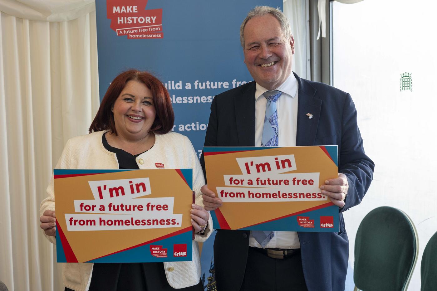 Paula Barker MP and Bob Blackman MP holdings signs that say 'I'm in for a future free from homelessness'
